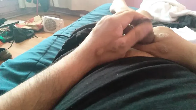 Attractive guy masturbates hard with his penis