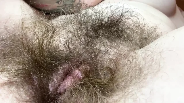 Hairy girl rubbing out her big clit