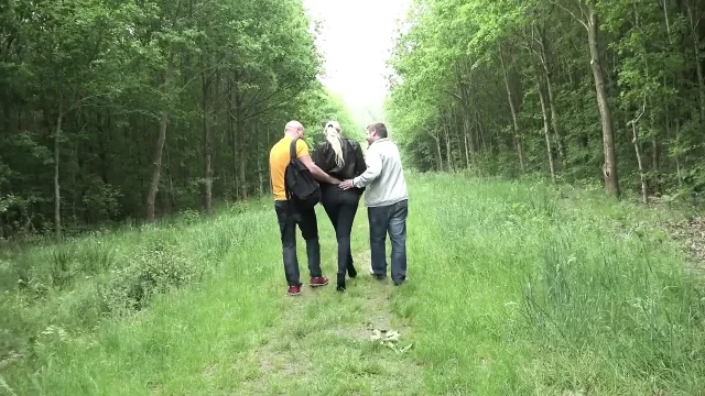 Blonde sucks two cocks then gets fucked to cumshot in the bushes