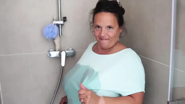 Mature Brunette with Massive Tits Gets Steamy in the Shower
