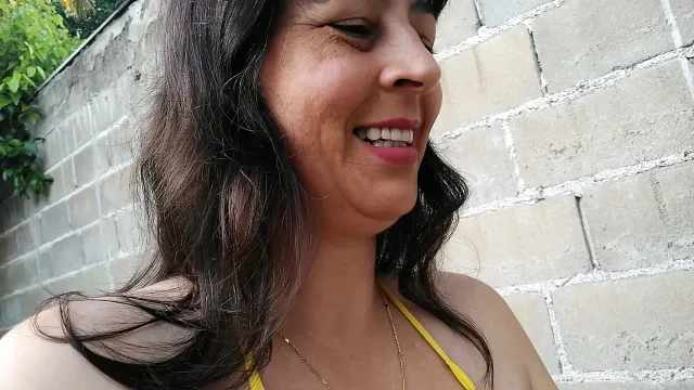 Amateur wife teasing you outside wearing a micro bikini