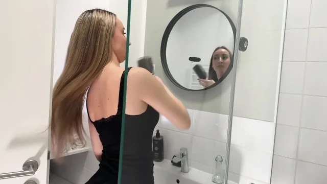 Amazingly beautiful college girl in the bathroom with a super skirt miniskirt