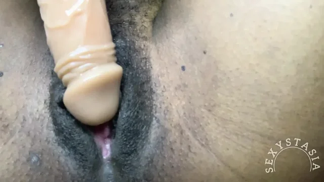 Sexy black girl rubs dildo on her pussy and cums hard