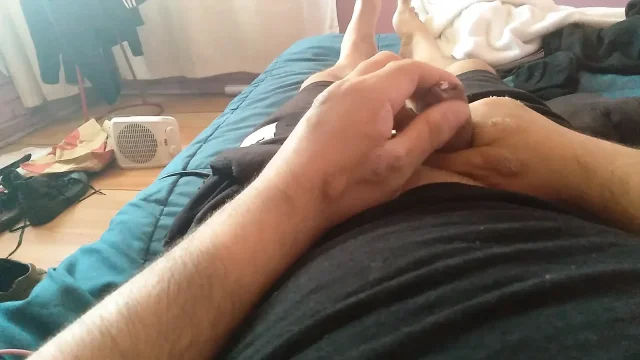 Cute gay man eagerly pulls back his foreskin