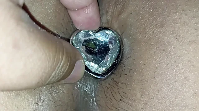 I fuck her ass with an anal plug in her ass and then I put my cock in the anus