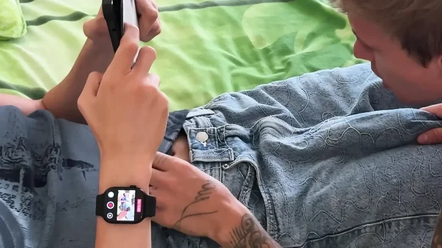 Guy gives throat to friend while he plays on phone