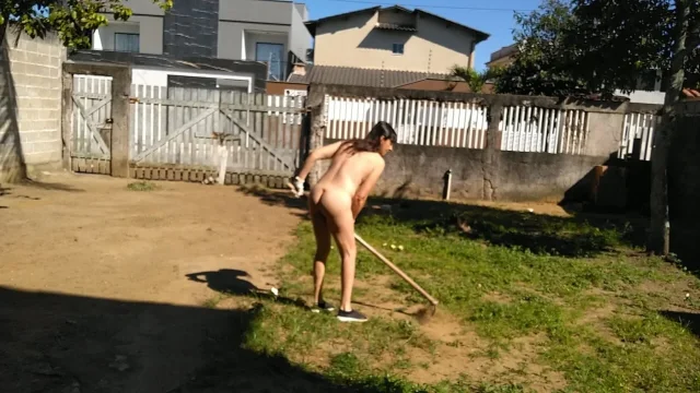 Housewife working naked in front yard while people was walking on street
