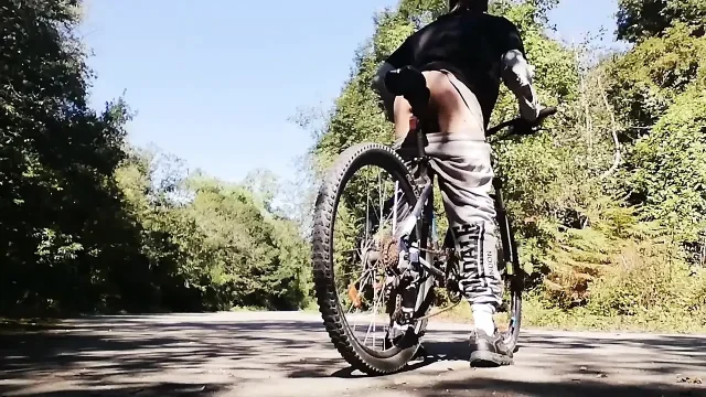 Young man playing with his bike with dildo in his ass