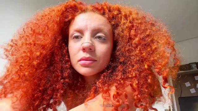 Naughty redhead squirts all over the bed