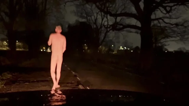 Patiently waiting naked outside for cars to hide from