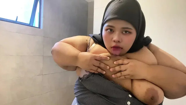 Hijabi sucking her own tits
