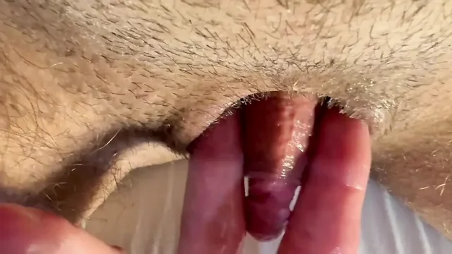 Pleasurable masturbation of a trans man's penis until orgasm