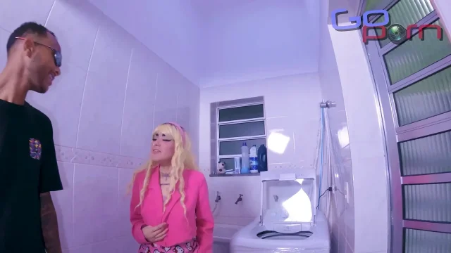 The guy comes from behind and fucks the hottie on top of the washer