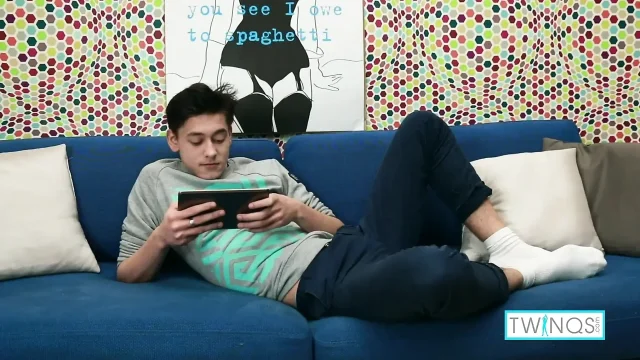 Brunette rainbow boy Logan filmed striping and masturbating