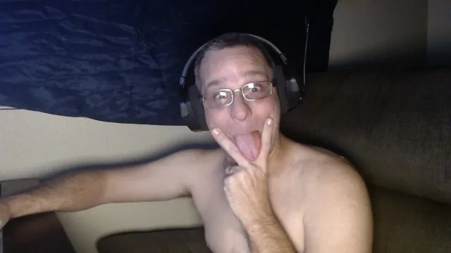 DubeSnackes sitting at his computer watching some porn on the computer so come watch him play with his fat juicy cock