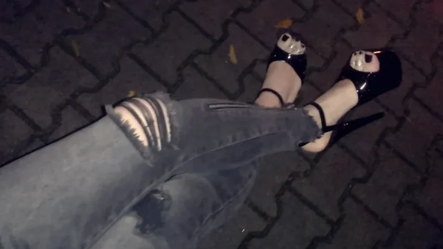 crossdresser in high heels on night walk